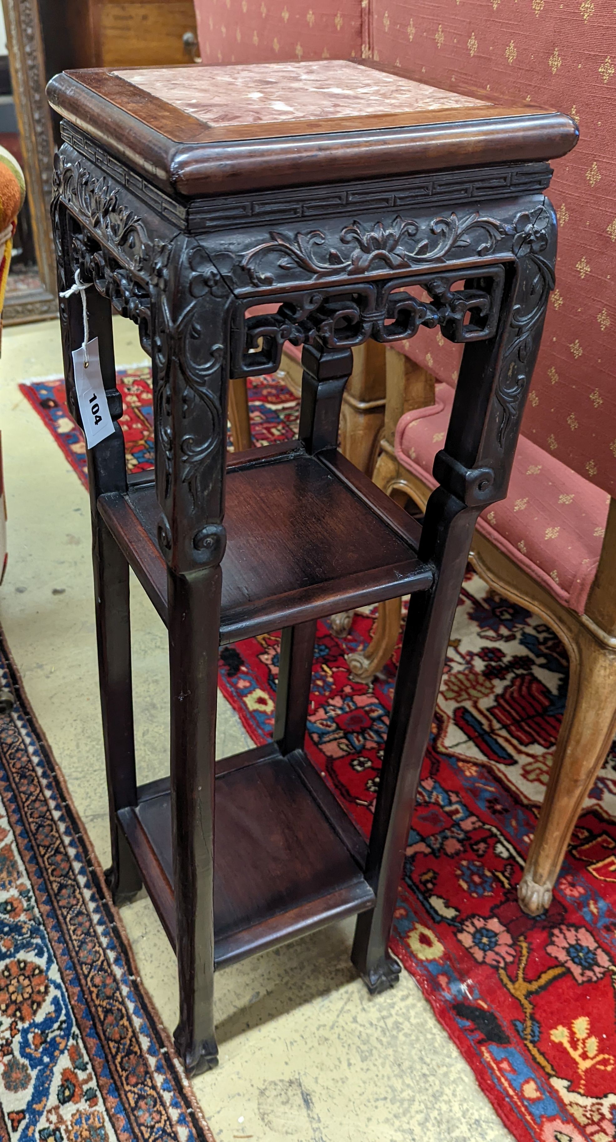 A Chinese carved hardwood three tier jardiniere stand, marble inset, width 22cm, depth 22cm, height 82cm